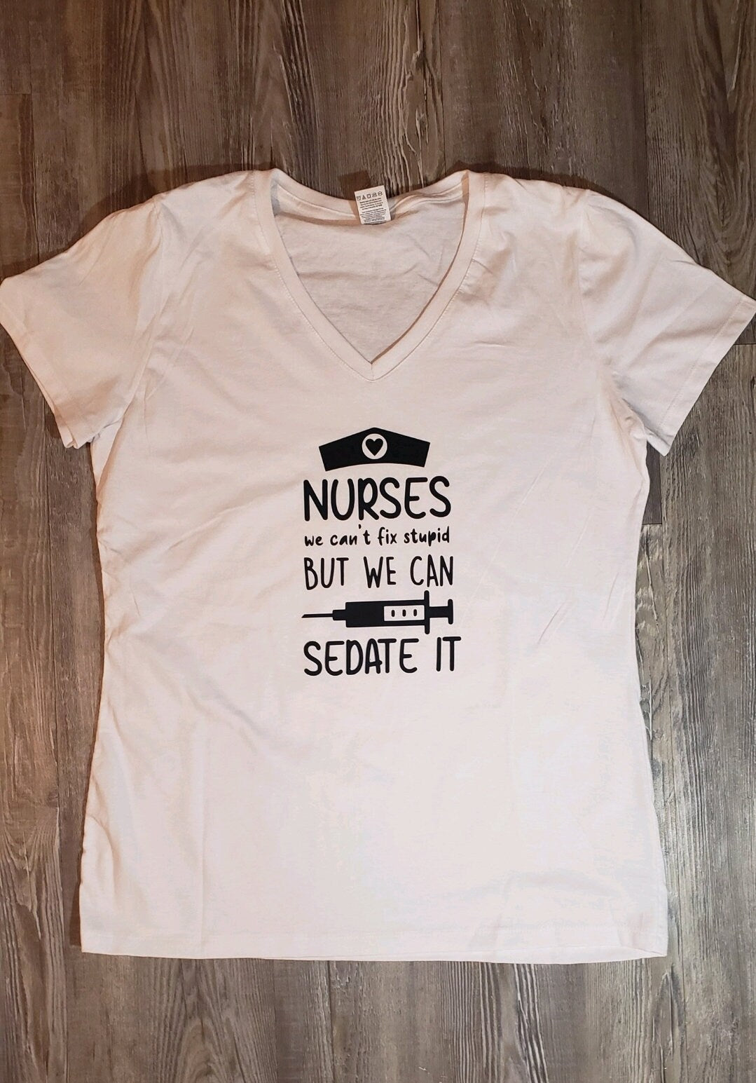 Nurses, We Can't Fix Stupid But We Can Sedate It. RN Graphic Shirt. Funny Nursing Shirt. Short Sleeve Graphic Tee - Glamorous Beauty & Boutique