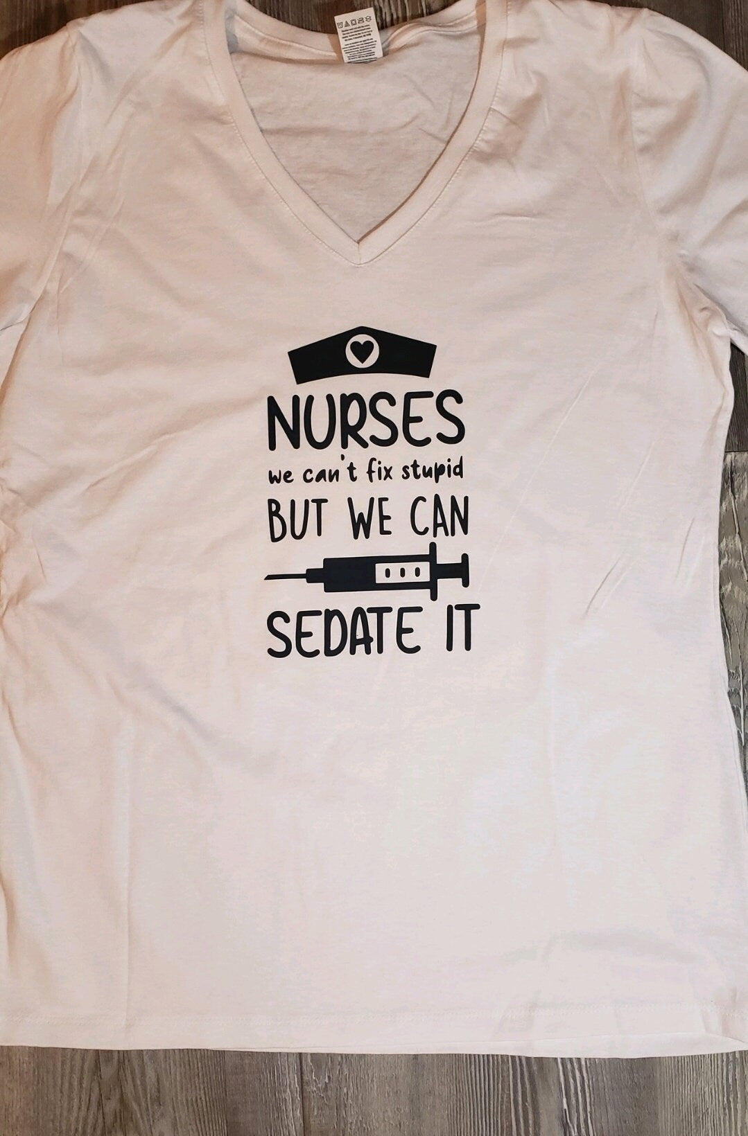 Nurses, We Can't Fix Stupid But We Can Sedate It. RN Graphic Shirt. Funny Nursing Shirt. Short Sleeve Graphic Tee - Glamorous Beauty & Boutique