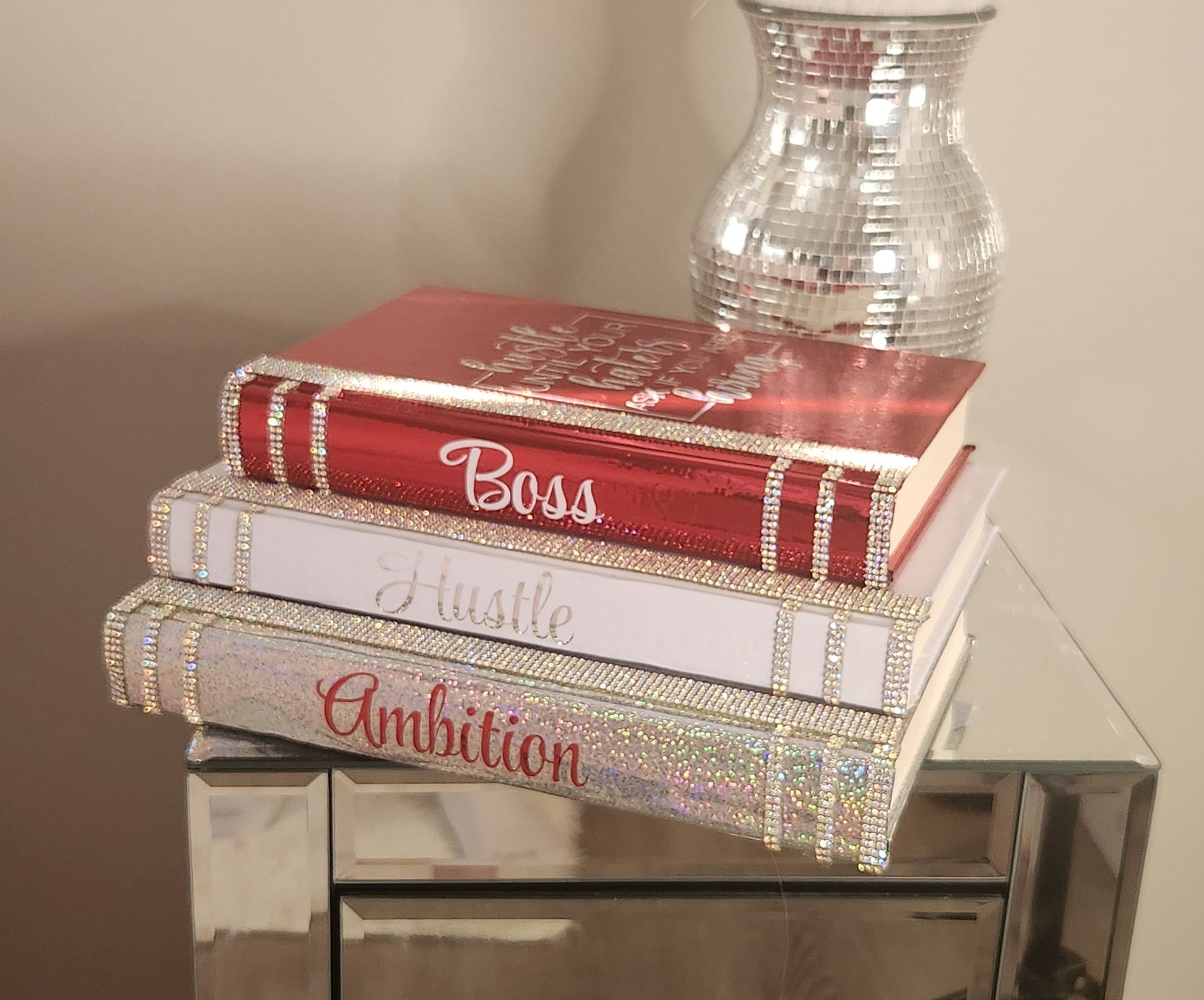 Coffee Table Book Stack (Set of 3). Glam Book Stack. White, Metallic Red & Silver Books. Home Decor. "BOSS, HUSTLE, AMBITION". Office Decor - Glamorous Beauty & Boutique