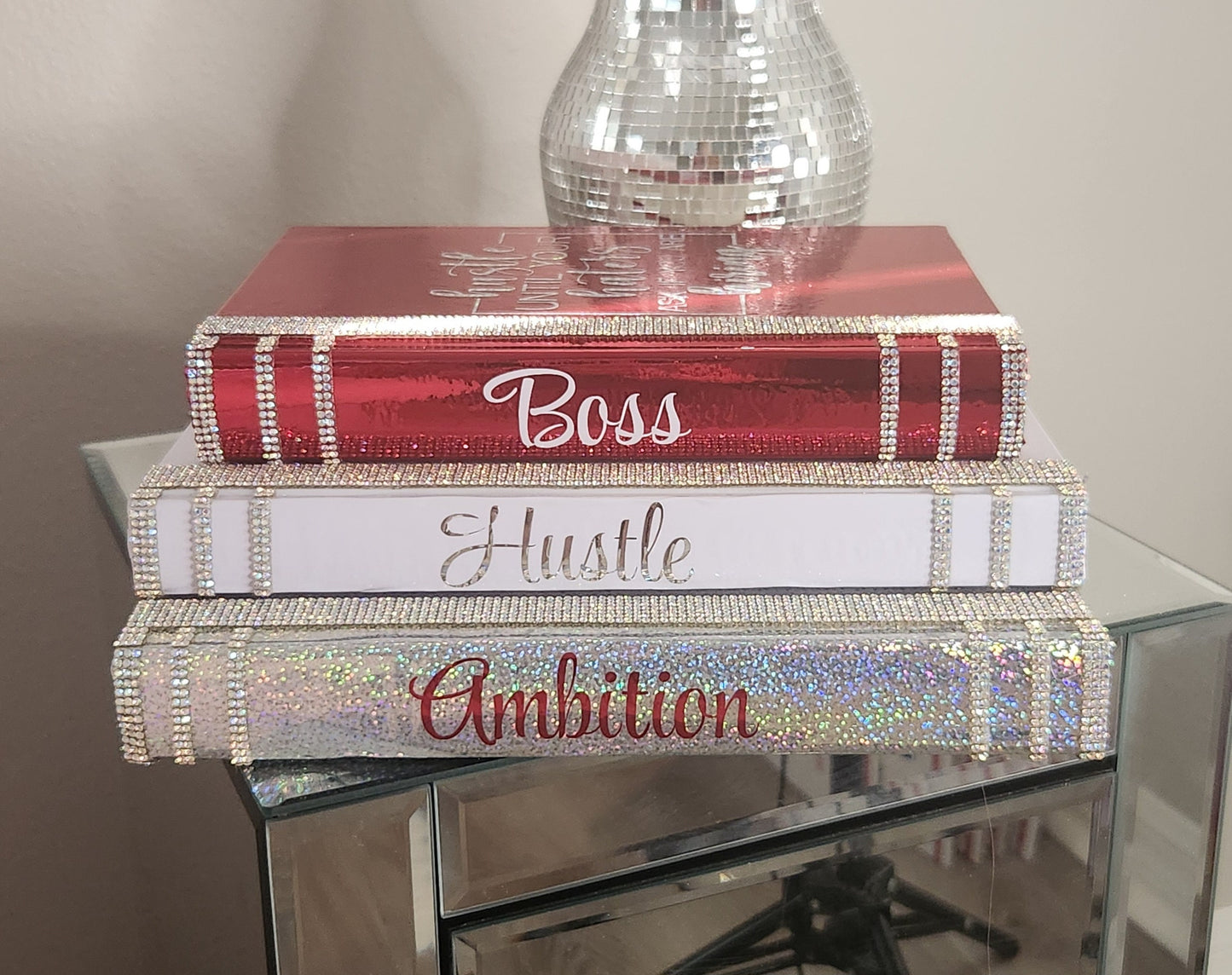 Coffee Table Book Stack (Set of 3). Glam Book Stack. White, Metallic Red & Silver Books. Home Decor. "BOSS, HUSTLE, AMBITION". Office Decor - Glamorous Beauty & Boutique