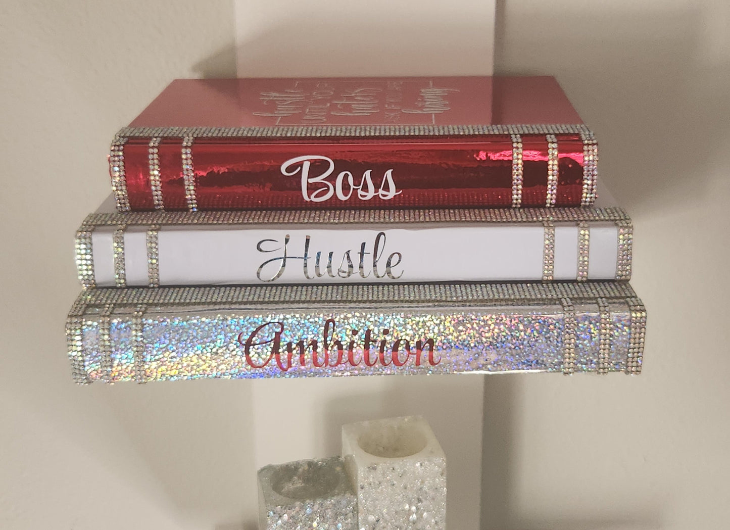 Coffee Table Book Stack (Set of 3). Glam Book Stack. White, Metallic Red & Silver Books. Home Decor. "BOSS, HUSTLE, AMBITION". Office Decor - Glamorous Beauty & Boutique