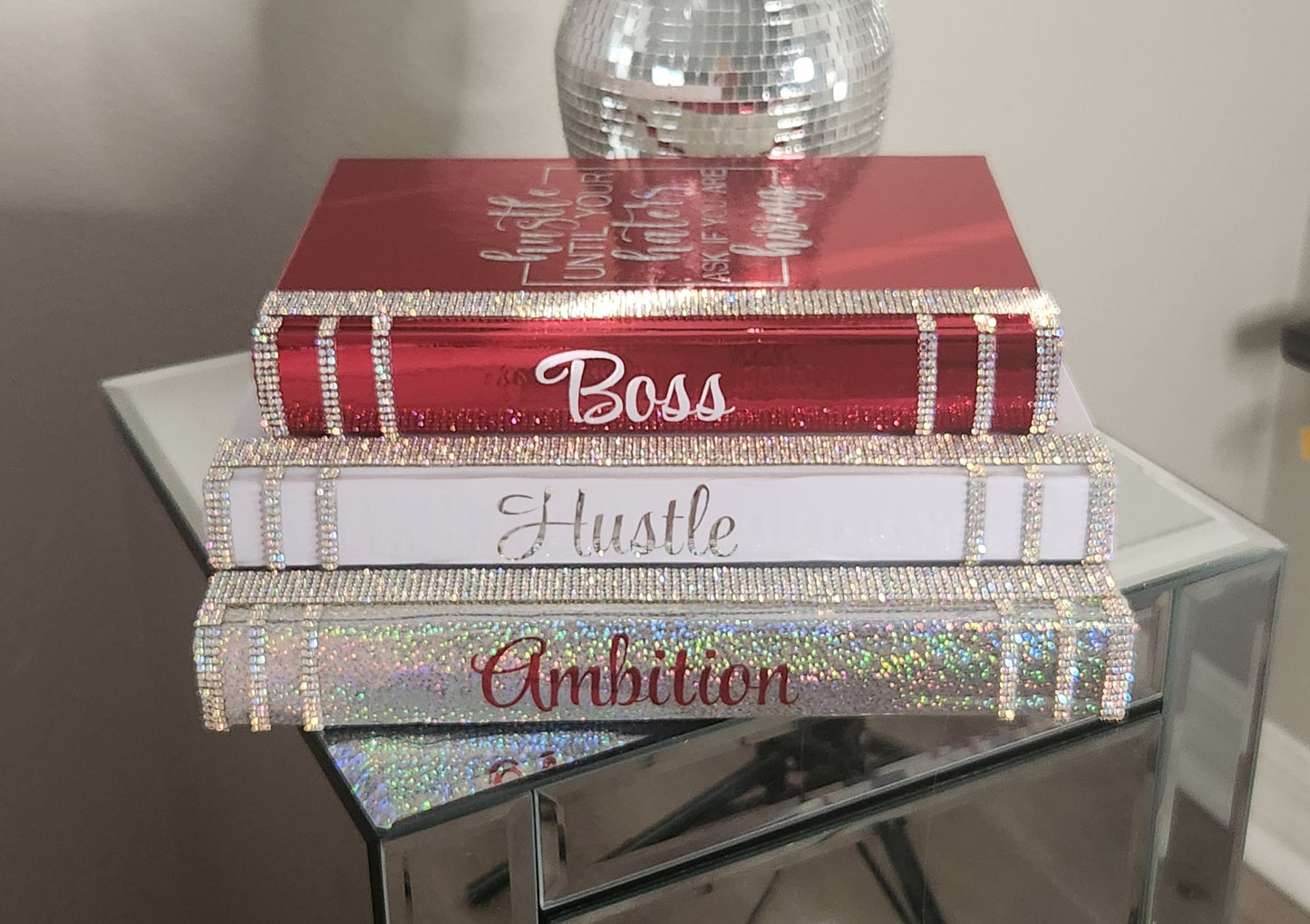 Coffee Table Book Stack (Set of 3). Glam Book Stack. White, Metallic Red & Silver Books. Home Decor. "BOSS, HUSTLE, AMBITION". Office Decor - Glamorous Beauty & Boutique